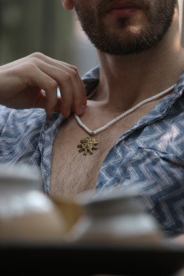 Brass sun necklace with white Beads